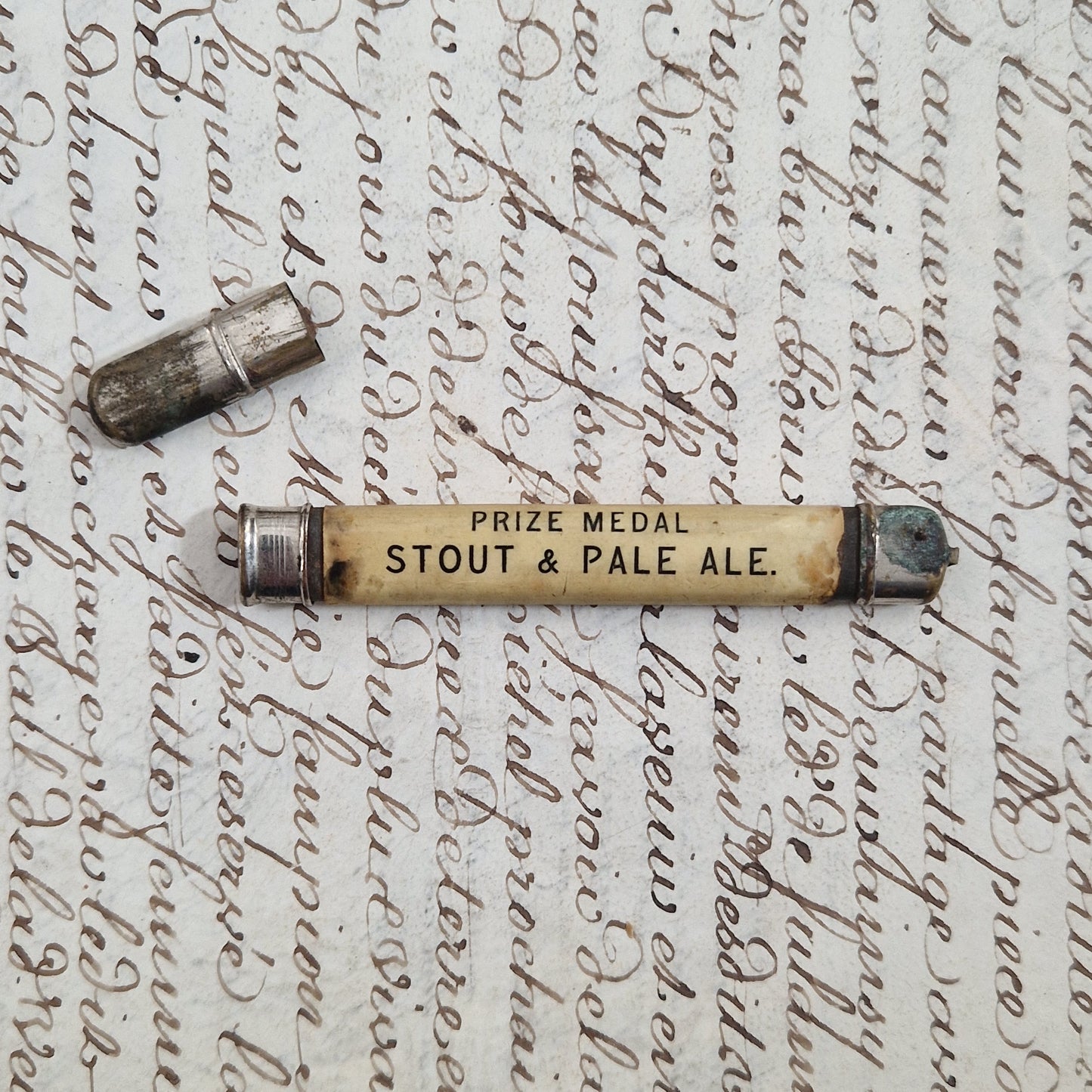 "J & T Usher, Bristol" promotional pencil holder