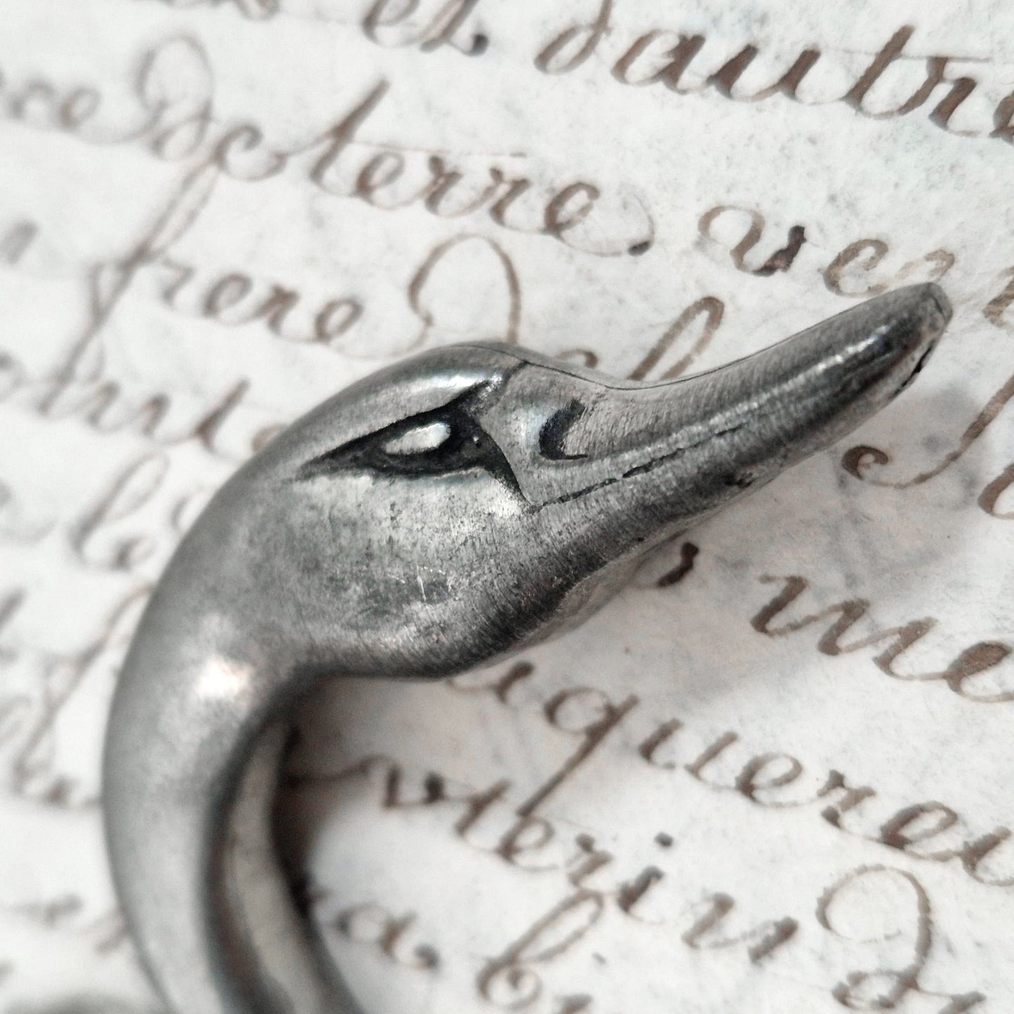 Antique pewter corkscrew decorated with swans