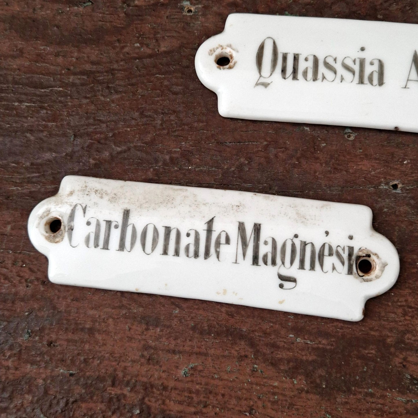 Pair of antique enamel pharmaceutical signs
