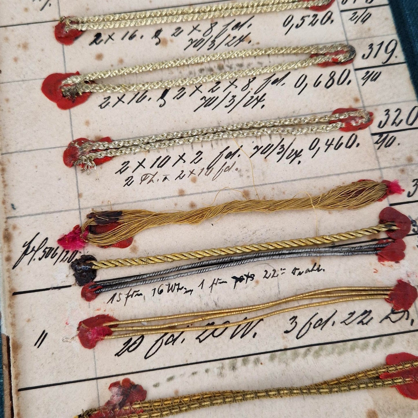Old thin cords made of gilded and silvered metallic threads