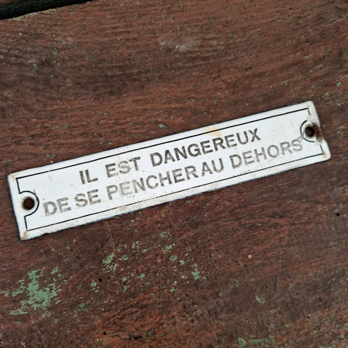 Plaque émaillée « Il est dangereux de se pencher... »