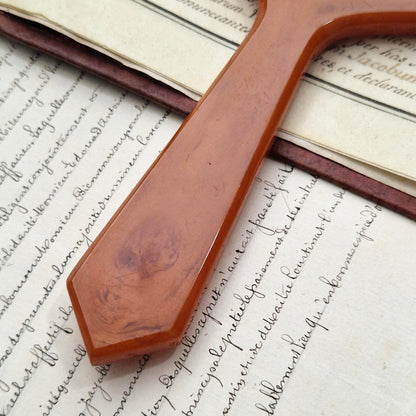 Loupe octogonale en bakélite marbrée, couleur caramel