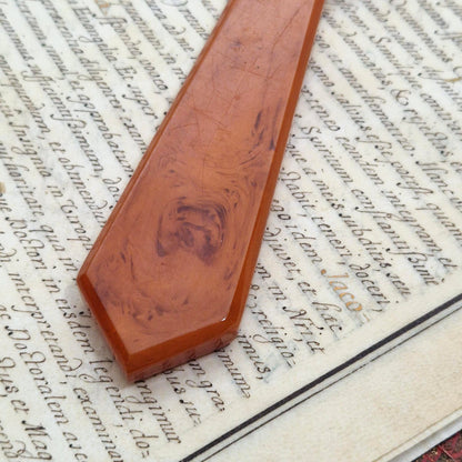 Loupe octogonale en bakélite marbrée, couleur caramel