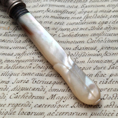 Antique magnifying glass with carved mother-of-pearl handle