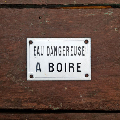Black enamel sign "Water dangerous to drink"