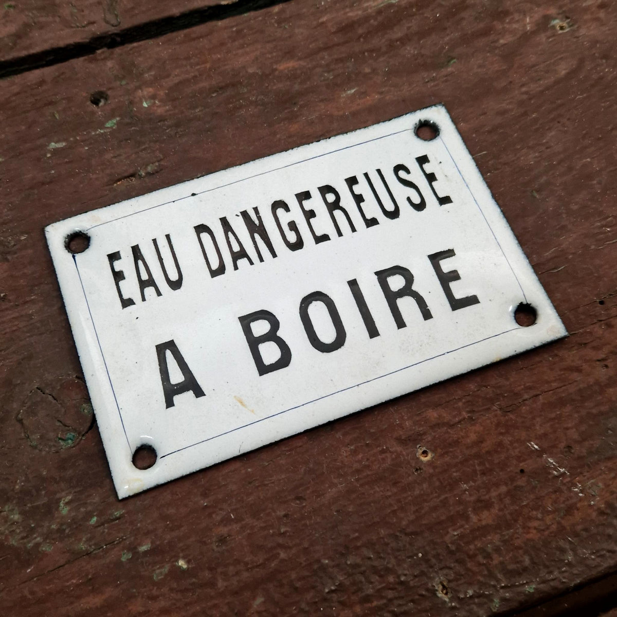 Black enamel sign "Water dangerous to drink"