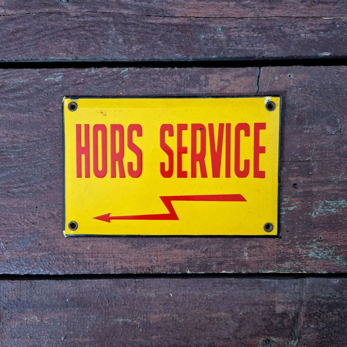 Old enamel sign reading "Out of service"