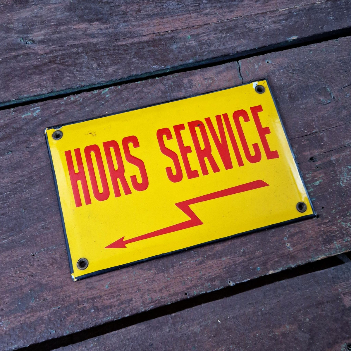 Old enamel sign reading "Out of service"