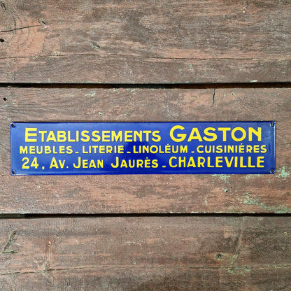 Plaque émaillée « Établissements Gaston – Meubles, literie... »