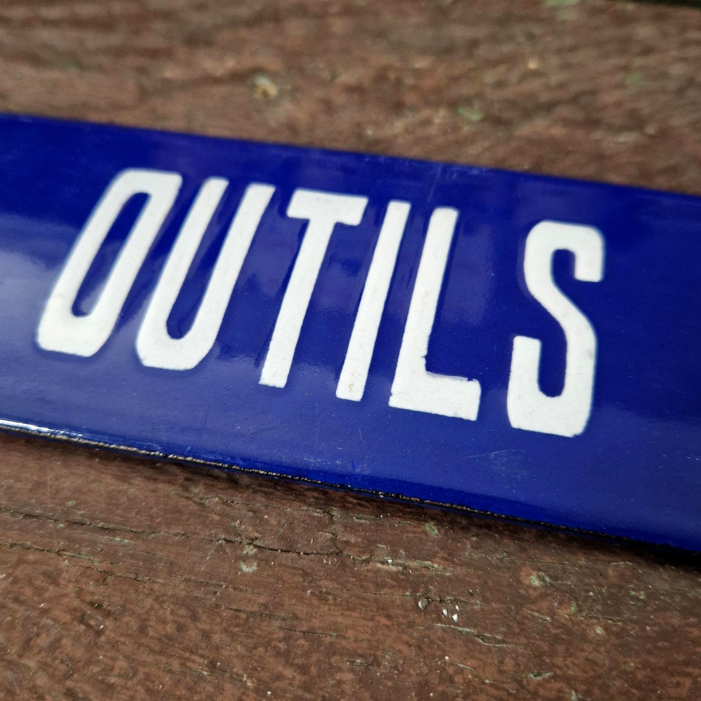 Blue enamel sign "Tools repaired"