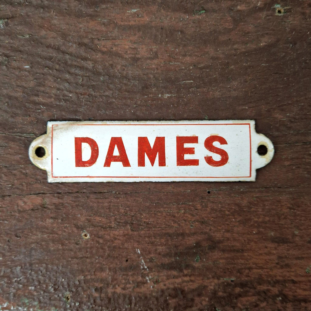 Red enamel sign "LADIES"