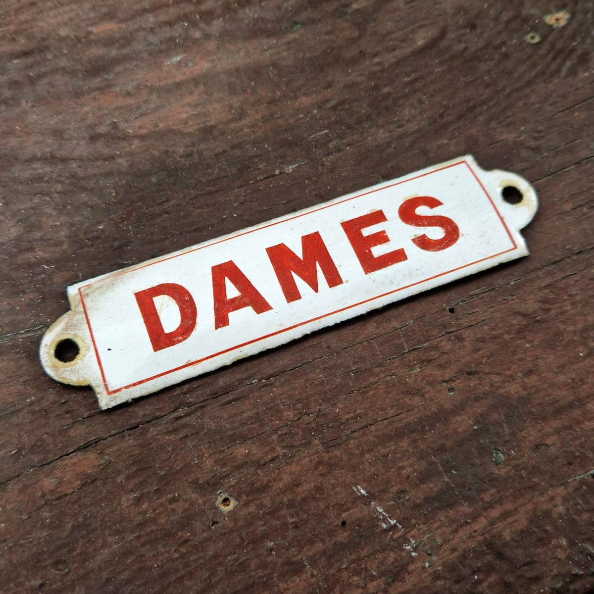 Red enamel sign "LADIES"