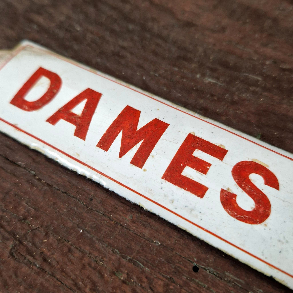 Red enamel sign "LADIES"
