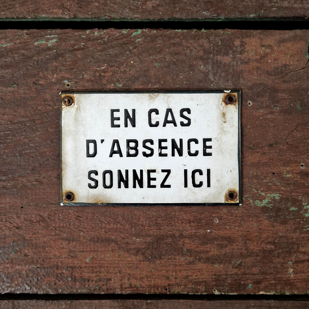 Enamel sign: "If no one is home, ring here"