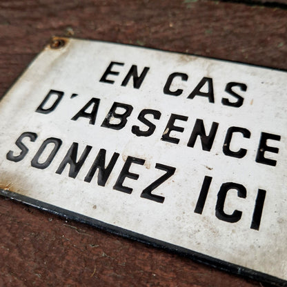 Enamel sign: "If no one is home, ring here"
