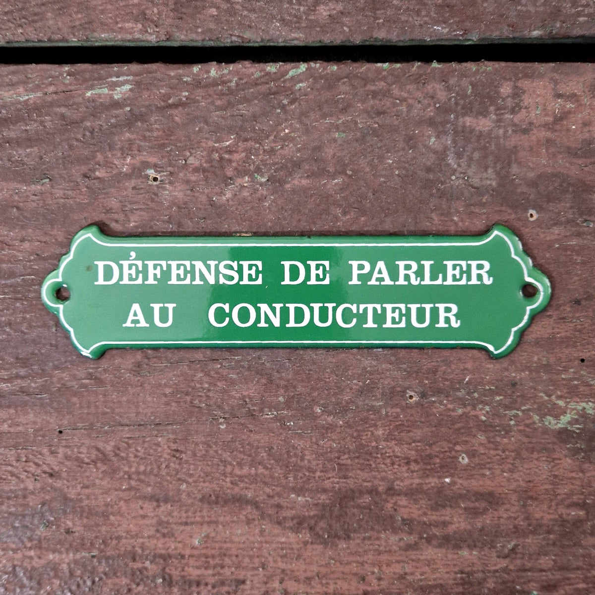 Enamel sign: "No talking to the driver"