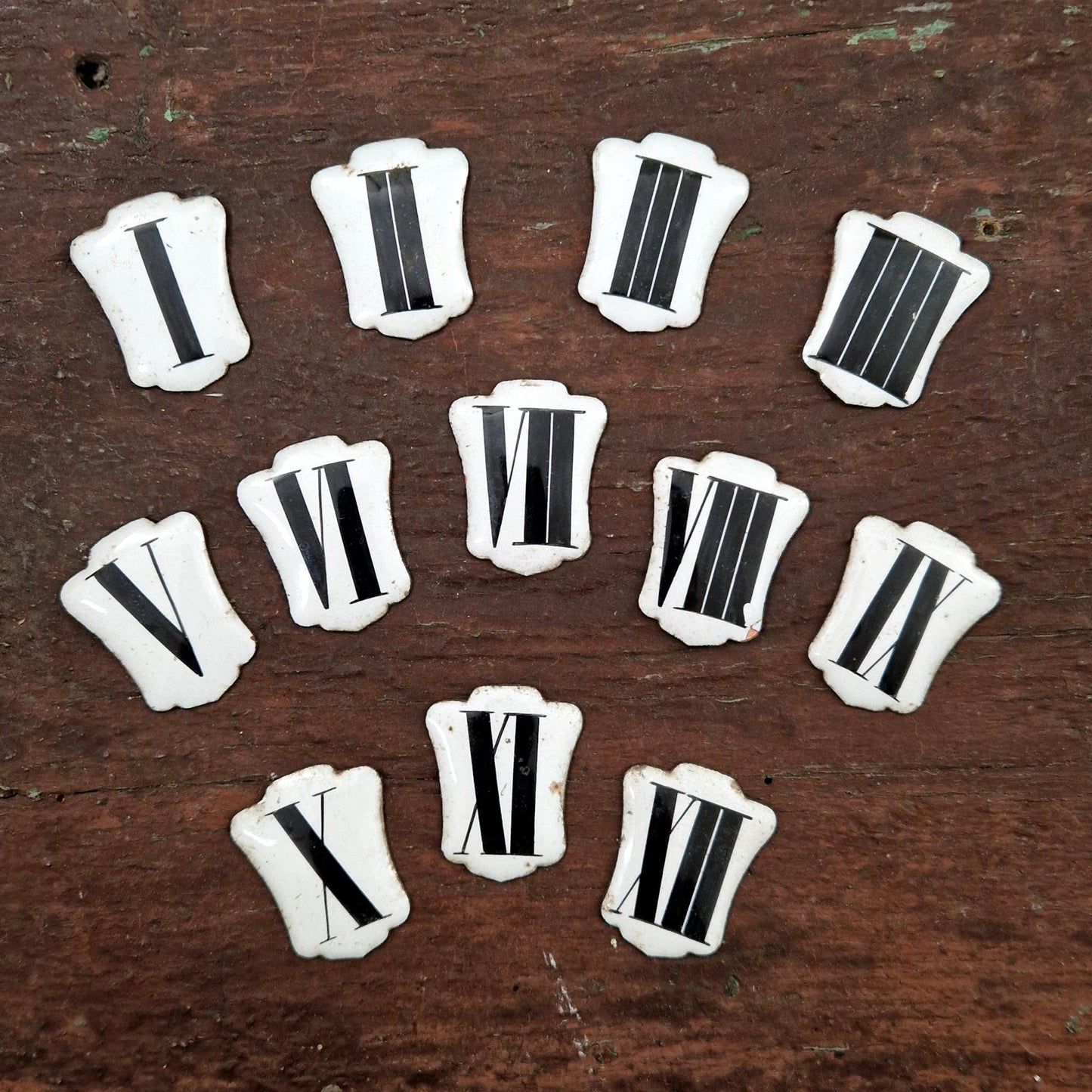 Enamelled Roman numerals for clock faces - I to XII