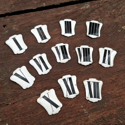 Enamelled Roman numerals for clock faces - I to XII