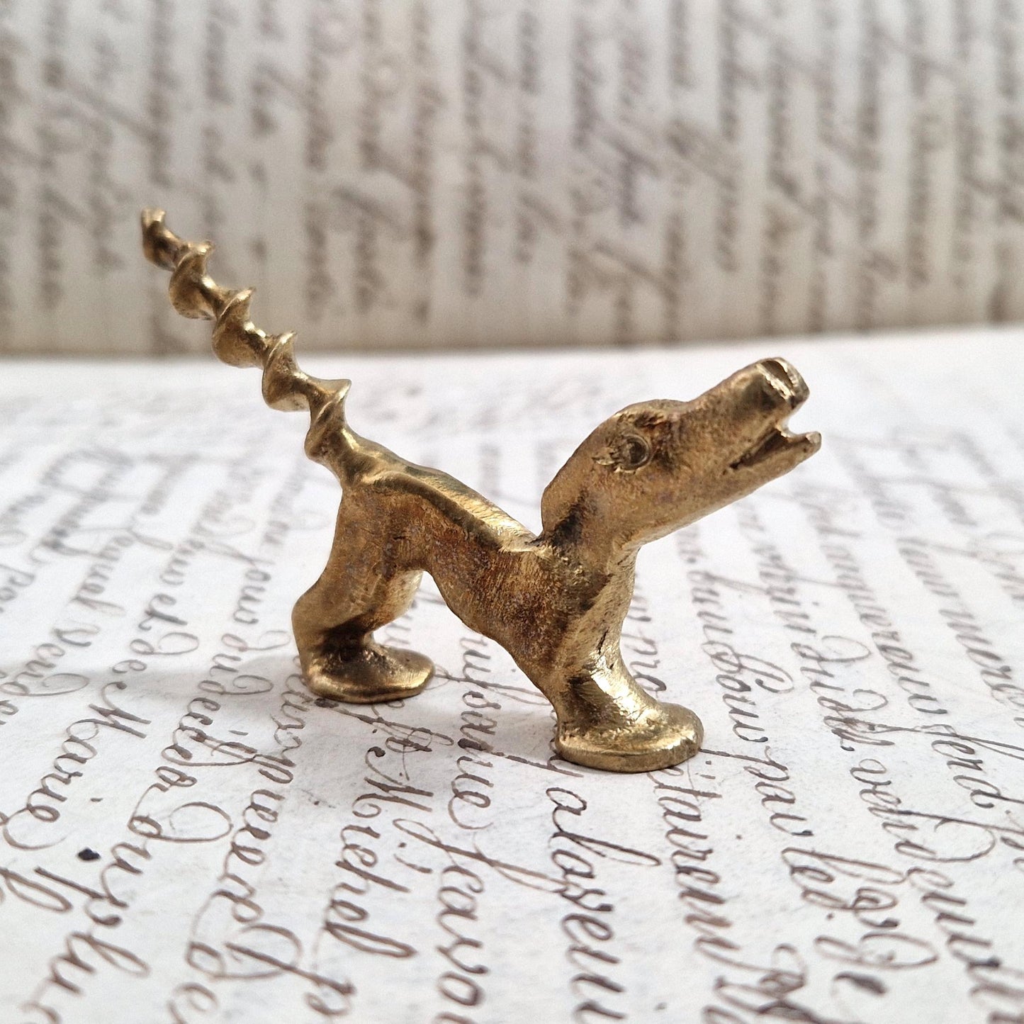 Antique figurative dog corkscrew in gilded metal