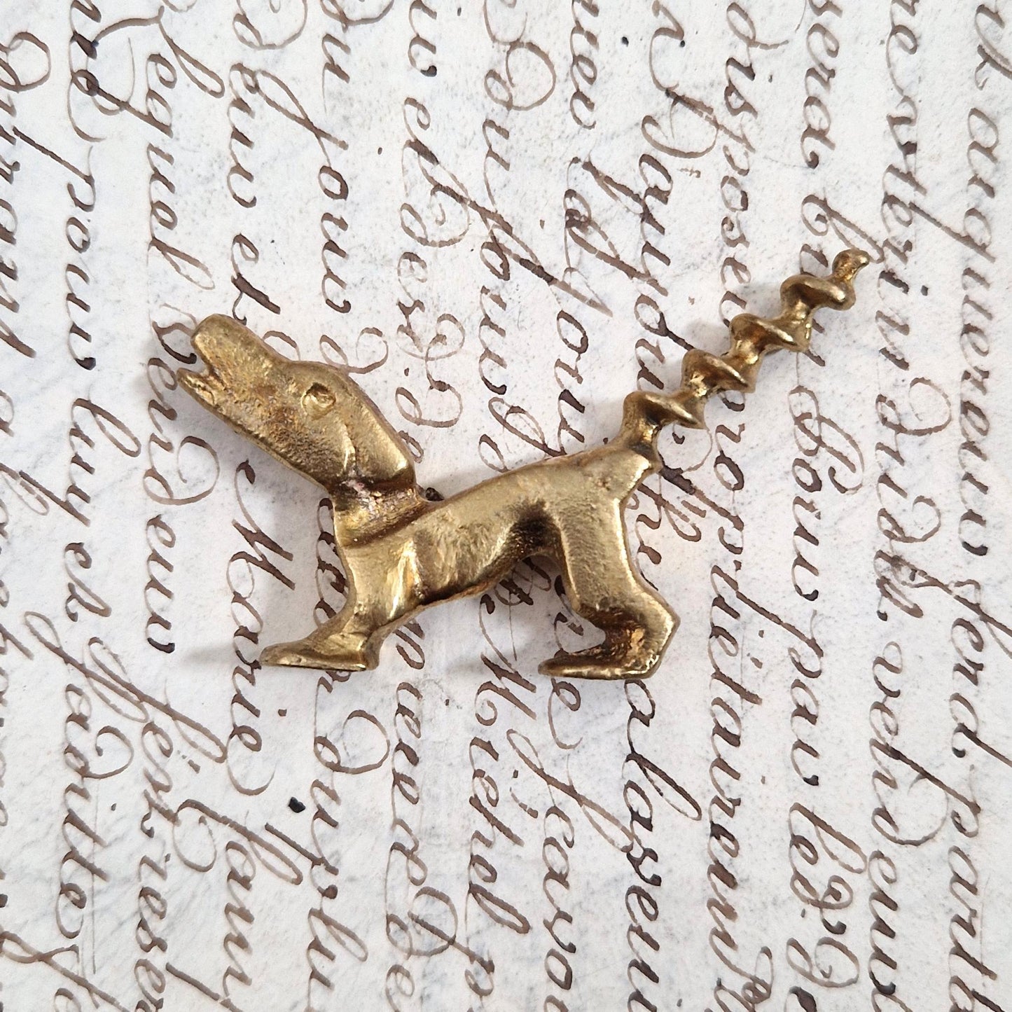 Antique figurative dog corkscrew in gilded metal