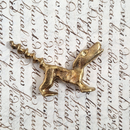Antique figurative dog corkscrew in gilded metal