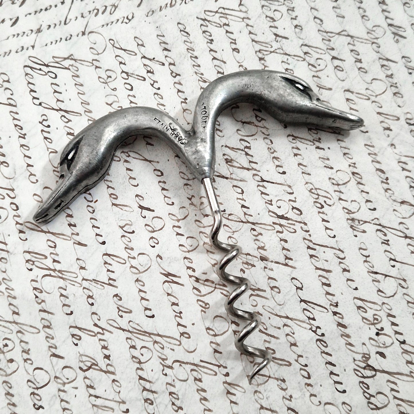 Antique pewter corkscrew decorated with swans