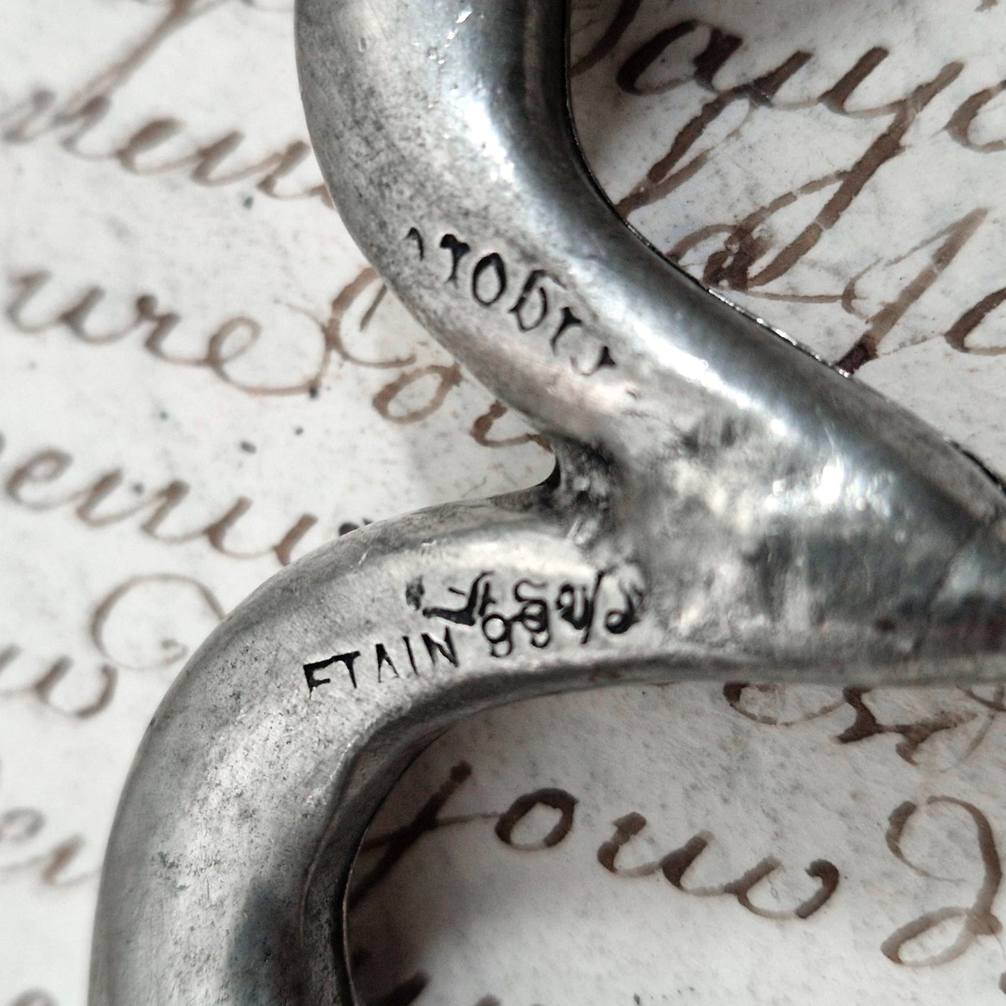 Antique pewter corkscrew decorated with swans