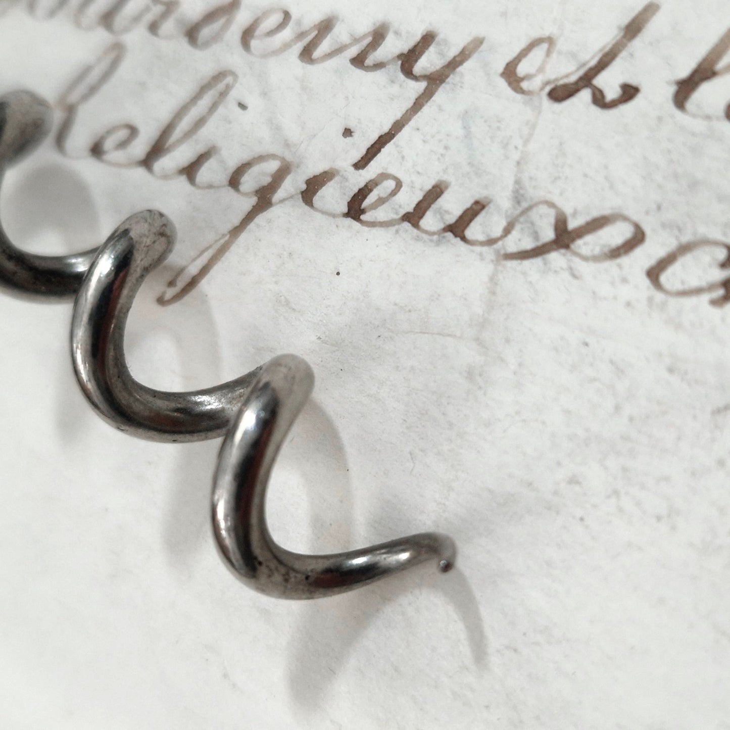 Antique pewter corkscrew decorated with swans