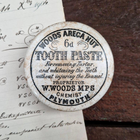 Antique lid for "Woods Areca Nut Tooth Paste"