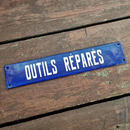Ancienne plaque émaillée « Outils réparés »