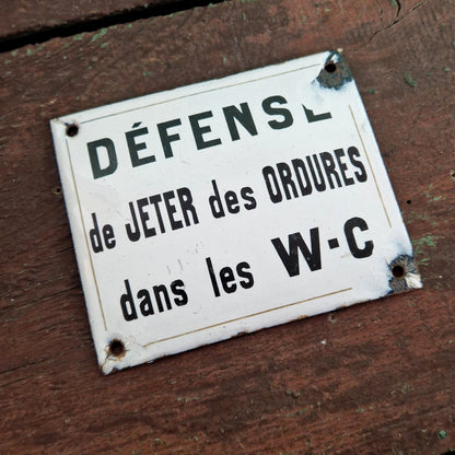 Plaque « Défense de jeter ... dans les W-C »