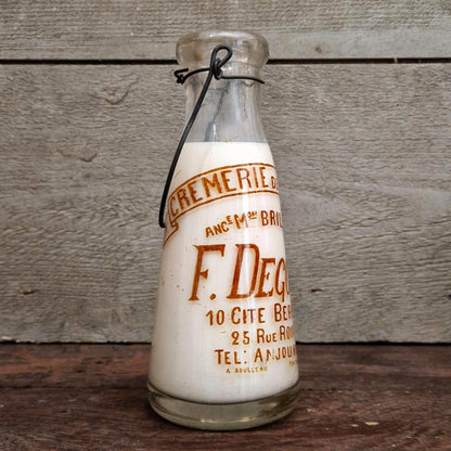 Bouteille de lait « F. Degoul, Crèmerie de la Cité » Paris