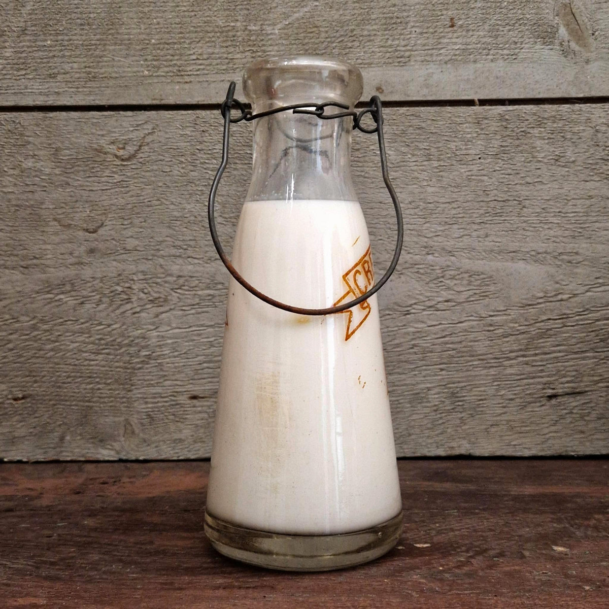 Bouteille de lait « F. Degoul, Crèmerie de la Cité » Paris