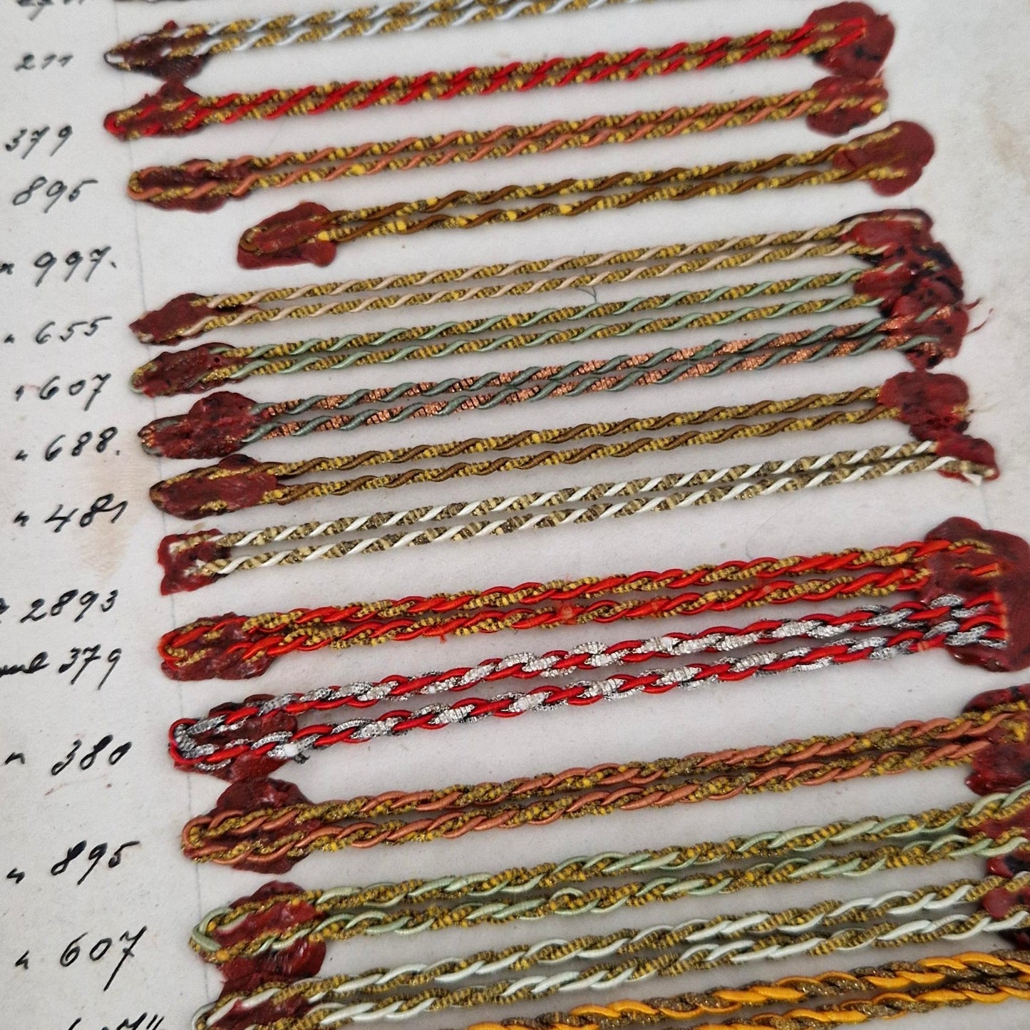 Sample board - Polychrome cords and metallic threads