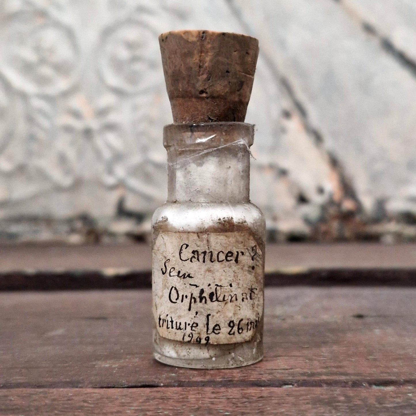 Medical curiosity: Vial "Cancer? Orphanage breast" (f27)
