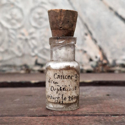 Medical curiosity: Vial "Cancer? Orphanage breast" (f27)