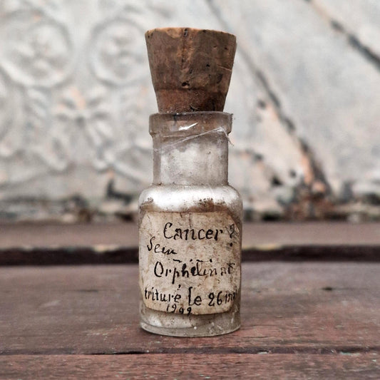 Medical curiosity: Vial "Cancer? Orphanage breast" (f27)