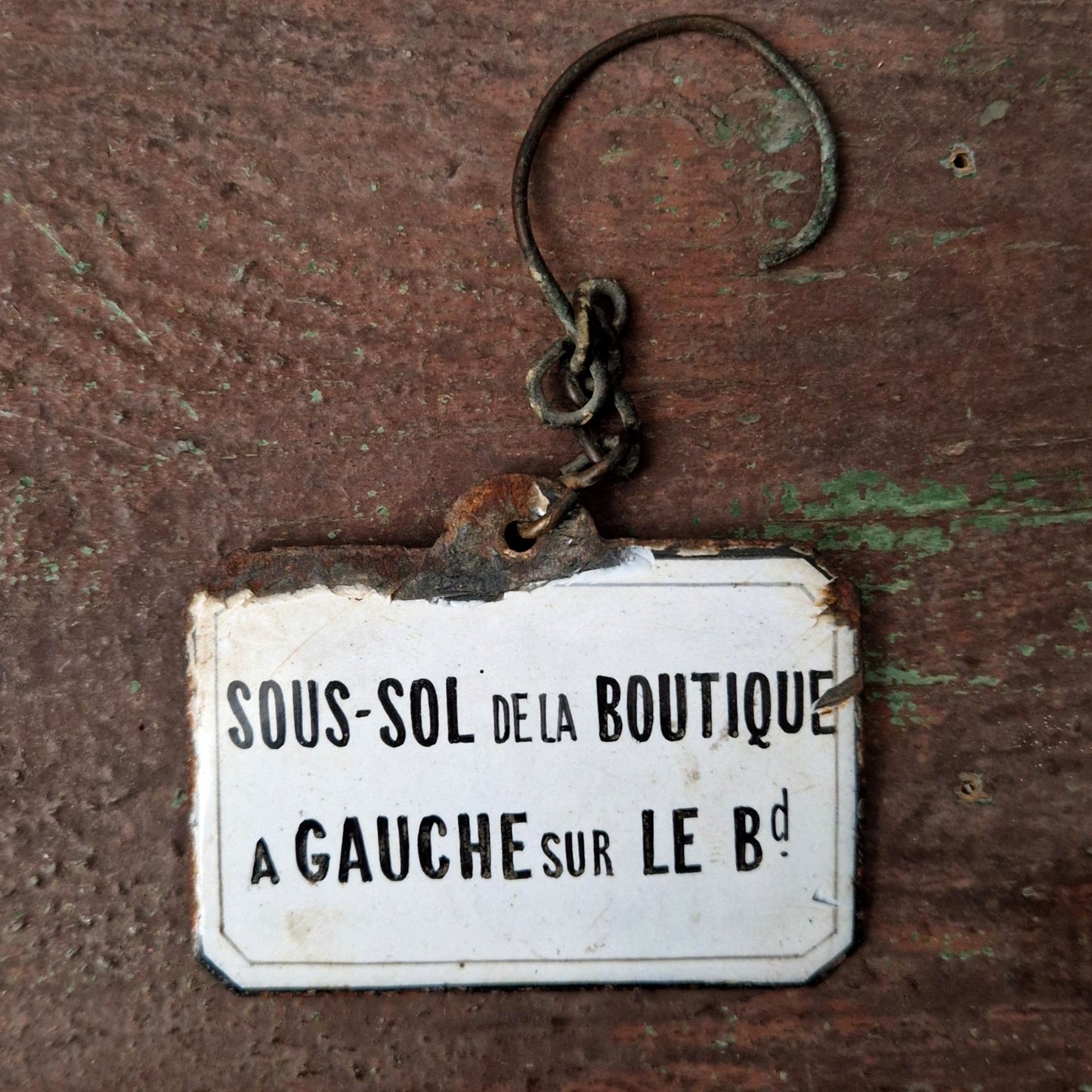 Enameled sign "Shop Basement"