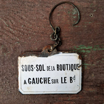 Enameled sign "Shop Basement"