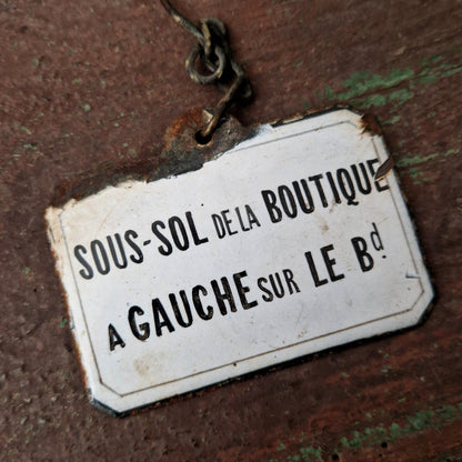 Enameled sign "Shop Basement"
