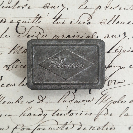 Antique embossed tin box "Feathers"