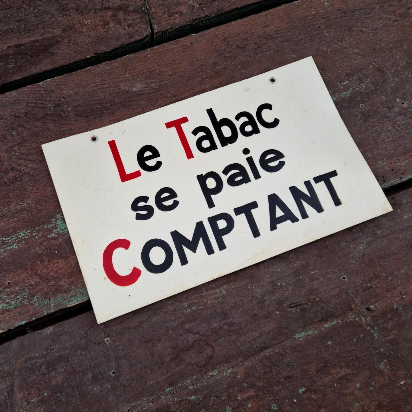 Pancarte peinte « Le Tabac se paie comptant »