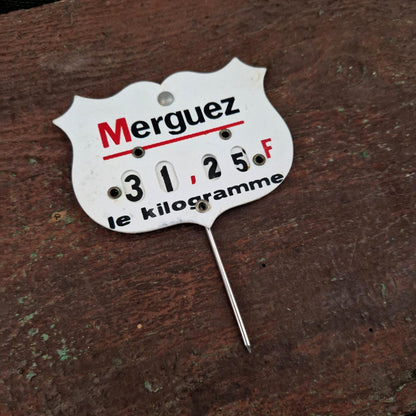 Étiquette de prix ancienne « Merguez » à roulettes