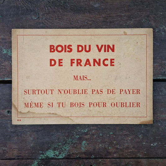 Sign: "Drink wine... but don't forget to pay"