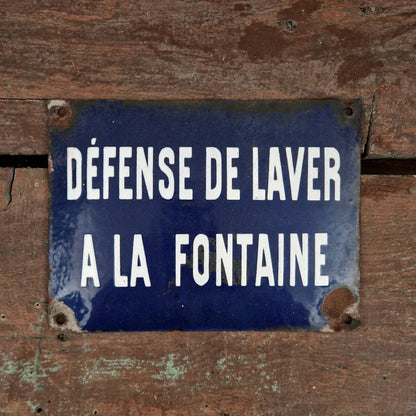Plaque émaillée  « Défense de laver à la fontaine »