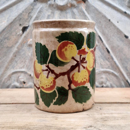 Old jam jar with apple or peach decoration