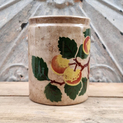 Old jam jar with apple or peach decoration