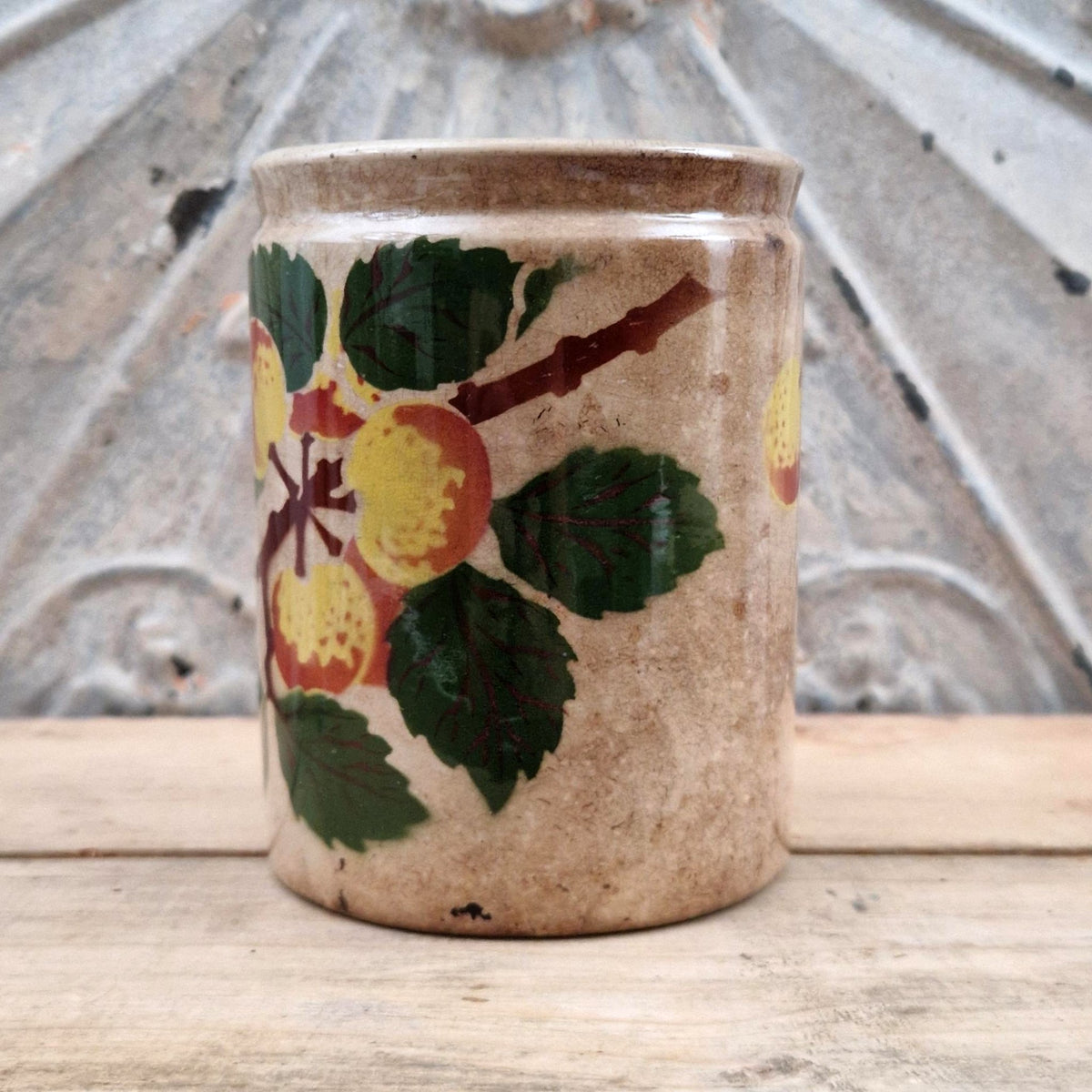 Old jam jar with apple or peach decoration