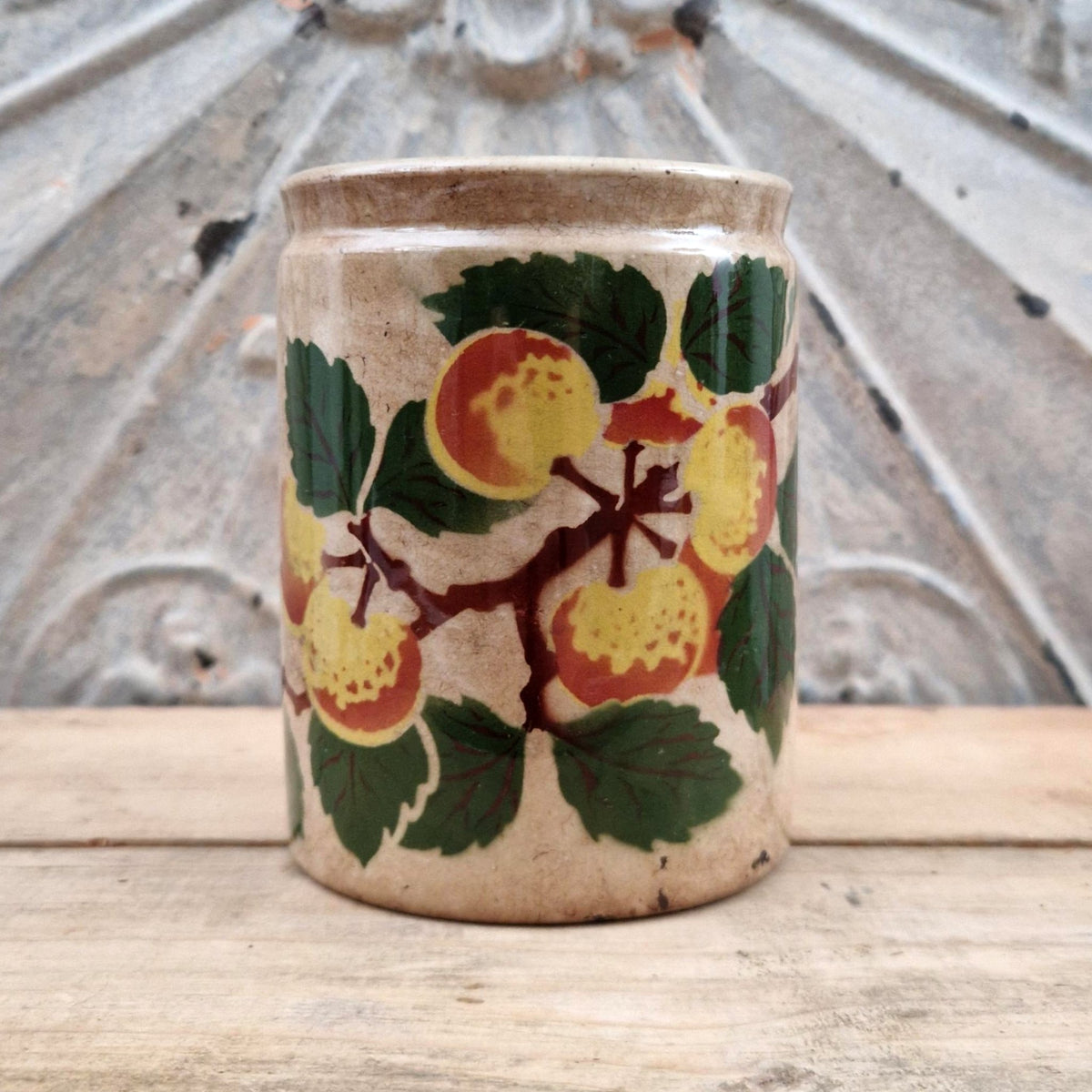 Old jam jar with apple or peach decoration