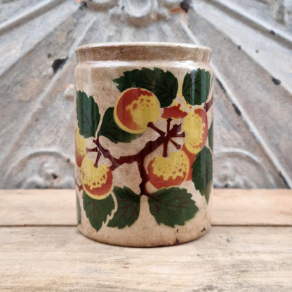 Old jam jar with apple or peach decoration